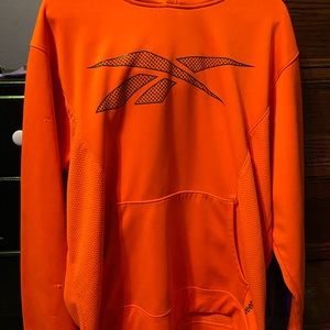 Bright orange Reebok sweater